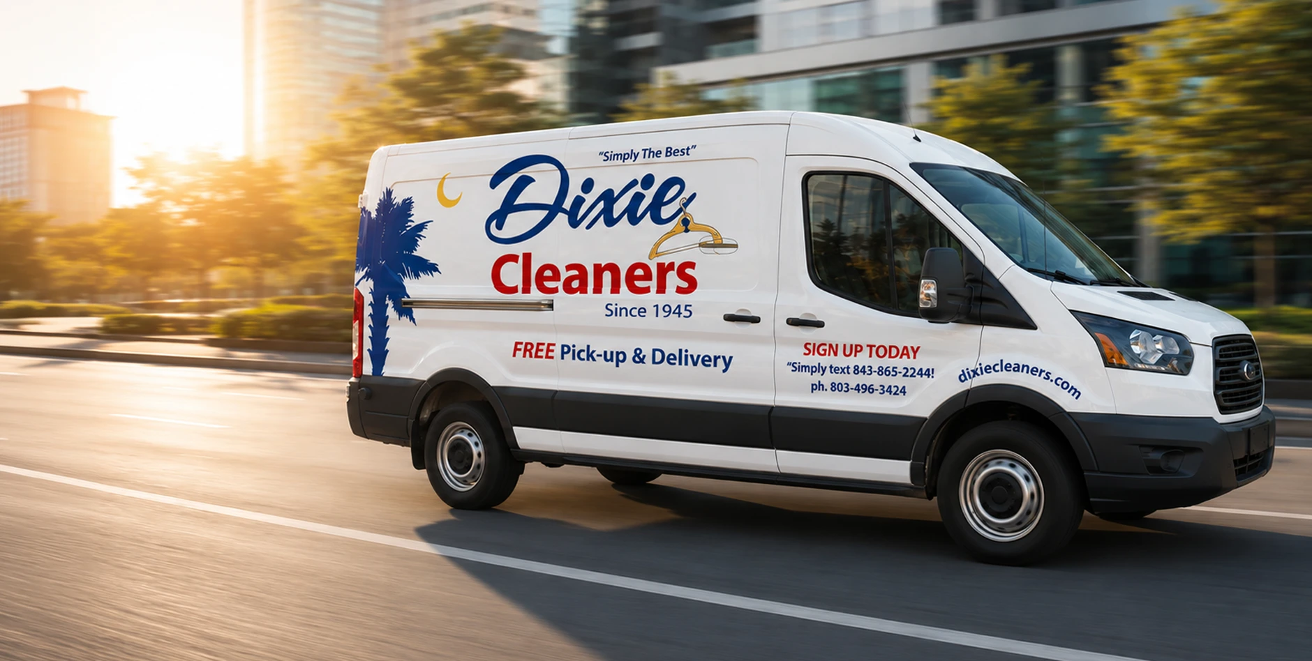 A Dixie Cleaners delivery van drives down a city street. The van advertises free pick-up and delivery and displays contact details and the company logo.